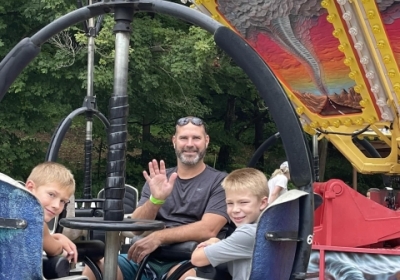 Dad with two boys on LOMB Tornado ride 