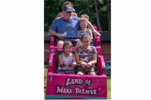 Dad with little girls on LOMB coaster