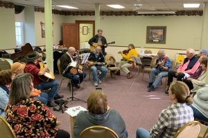 People playing musical instruments and singing at Hope Hootenanny